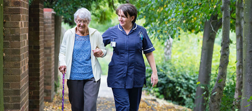 Two people walking at an Arizona Long Term Care Facility 