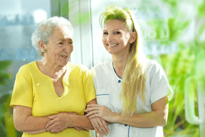 A caregiver with an elderly patient. 